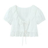 LIZAKOSHT - Sexy White Embroidery Hollow Out Hole Wood ears O neck Short Puff Sleeve Shirt Women Ruffles Hem Front Bow Lacing Up Crop Tops