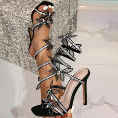LIZAKOSHT - Serpentine Wrap Strap Open-toed Rhinestone Flash Diamond Bow Thin Heel High Heel Sexy Sandals Women's Shoes
