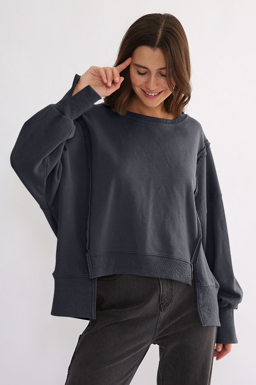 LIZAKOSHT  -  Exposed Seam High-Low Long Sleeve Sweatshirt