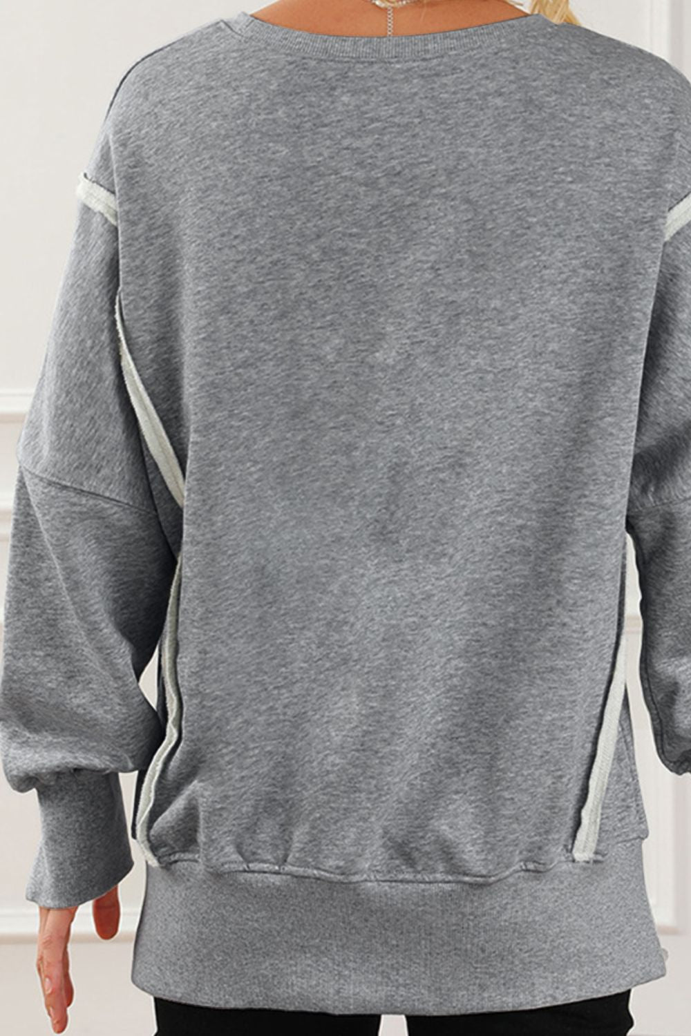 LIZAKOSHT  -  Exposed Seam High-Low Long Sleeve Sweatshirt