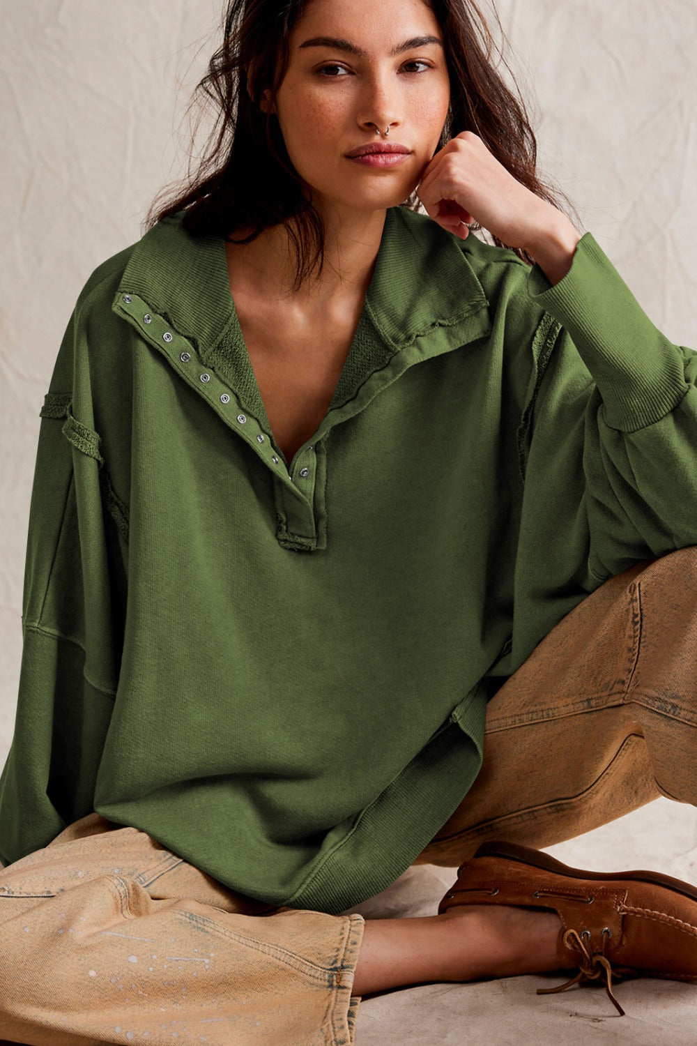 LIZAKOSHT  -  Exposed Seam Side Slit Long Sleeve Sweatshirt