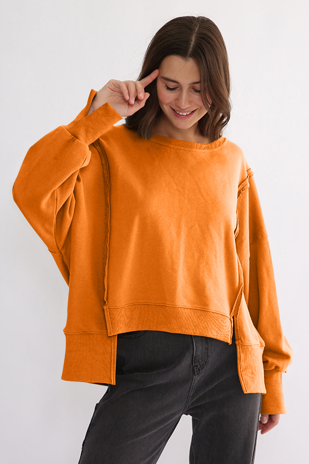 LIZAKOSHT  -  Exposed Seam High-Low Long Sleeve Sweatshirt
