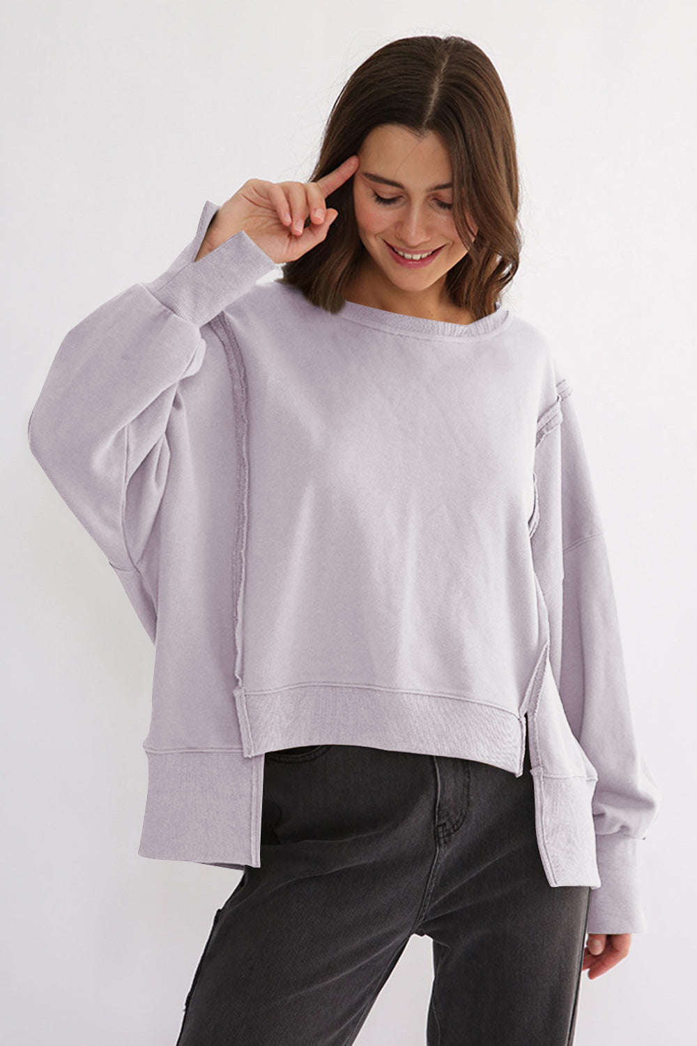 LIZAKOSHT  -  Exposed Seam High-Low Long Sleeve Sweatshirt