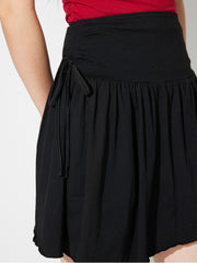 LIZAKOSHT  -  Side Tie Asymmetric Hem Mini Skirt
