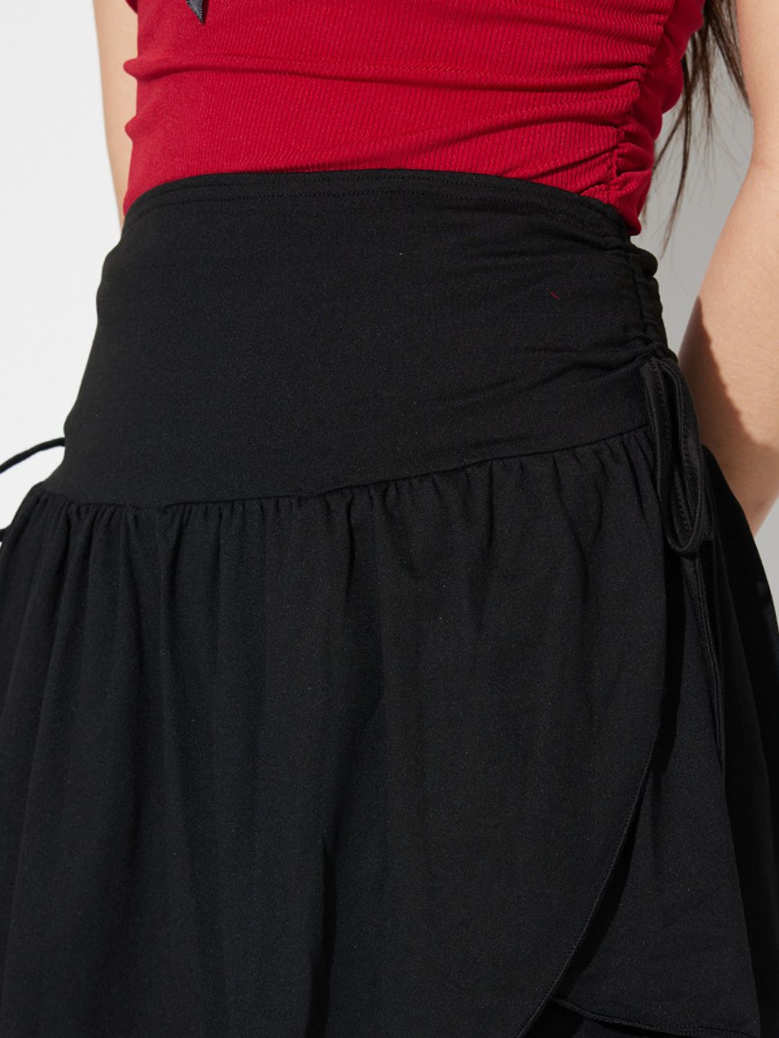 LIZAKOSHT  -  Side Tie Asymmetric Hem Mini Skirt