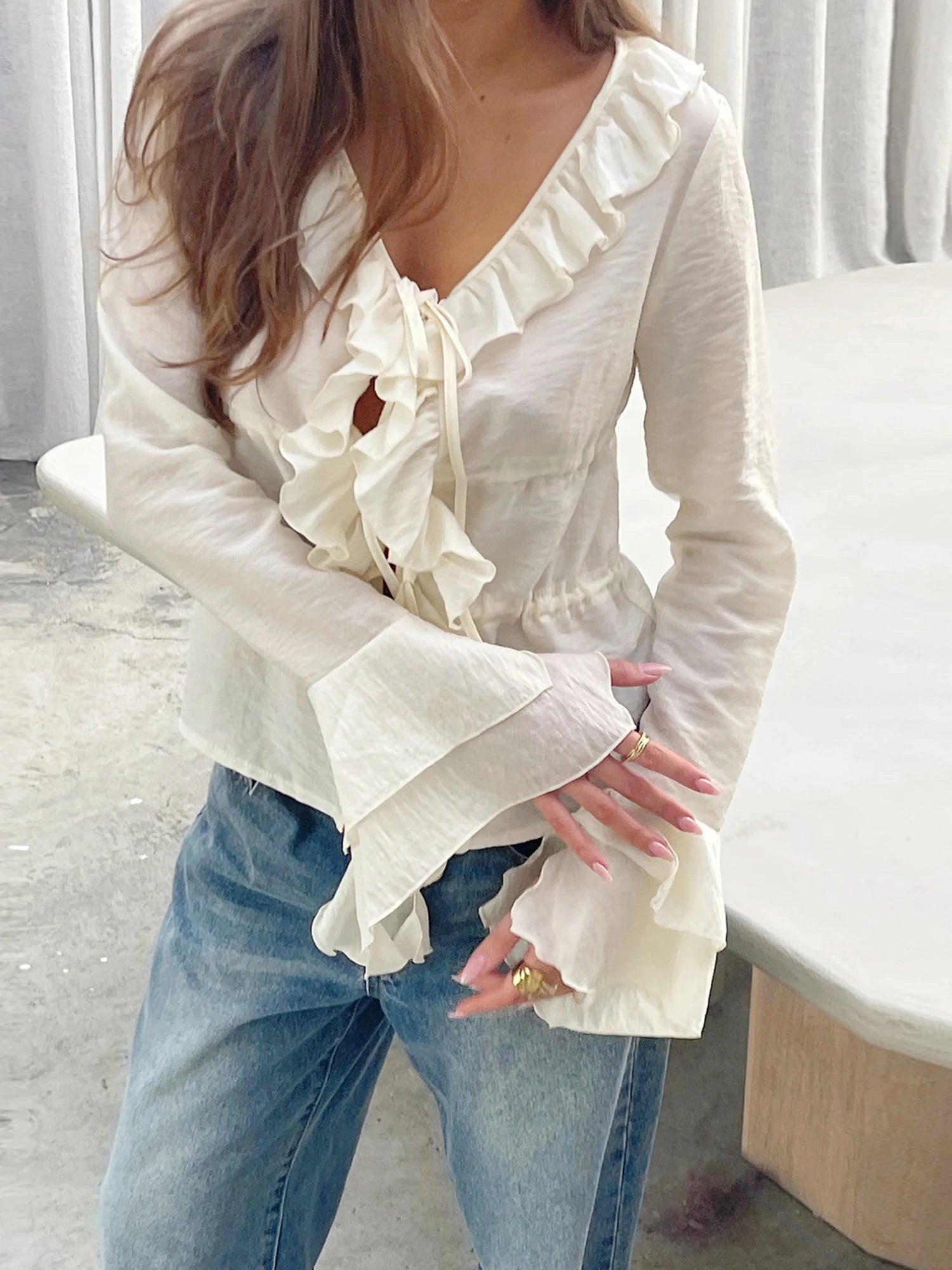LIZAKOSHT  -  Elegant Women s V-Neck Peplum Blouse with Flowy Front Bow Tie Long Sleeve and Ruffle Trim Detail for a Stylish Look