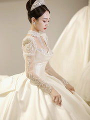 LIZAKOSHT  -  Satin Luxury Wedding Dresses Illusion O Neck Applique Sequined Beads Full Sleeve A Line Robe De Mariée Vestido Bow Bridal Gowns