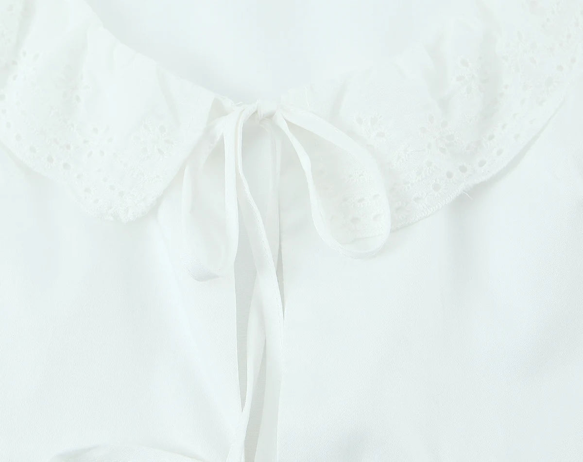 LIZAKOSHT  -  Sexy White Embroidery Hollow Out Hole Wood ears O neck Short Puff Sleeve Shirt Women Ruffles Hem Front Bow Lacing Up Crop Tops