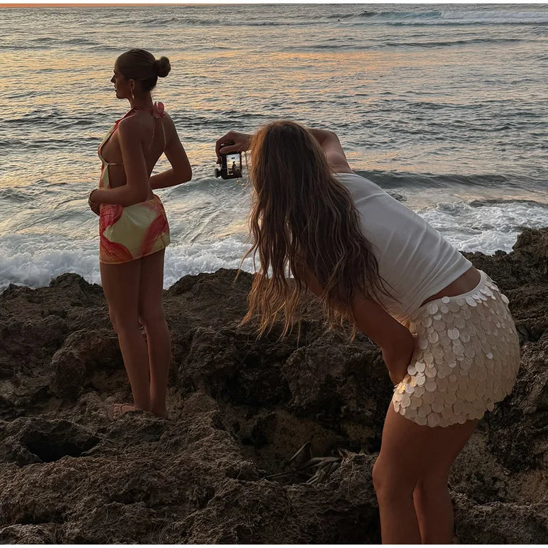 LIZAKOSHT  -  Sexy Beach Mini Skirts Women Slim Fashion Chic Shiny Short Skirt Female 2025 Spring Summer High Waist Solid Vacation Streetwear