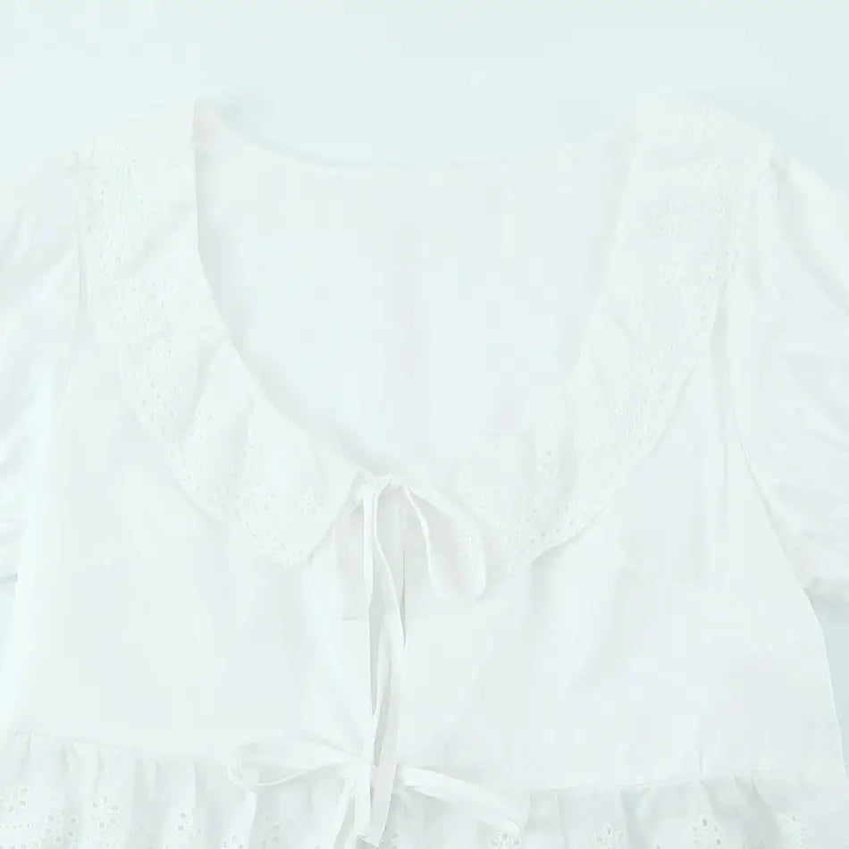 LIZAKOSHT  -  Sexy White Embroidery Hollow Out Hole Wood ears O neck Short Puff Sleeve Shirt Women Ruffles Hem Front Bow Lacing Up Crop Tops