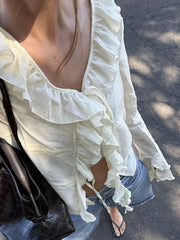 LIZAKOSHT  -  Elegant Women s V-Neck Peplum Blouse with Flowy Front Bow Tie Long Sleeve and Ruffle Trim Detail for a Stylish Look