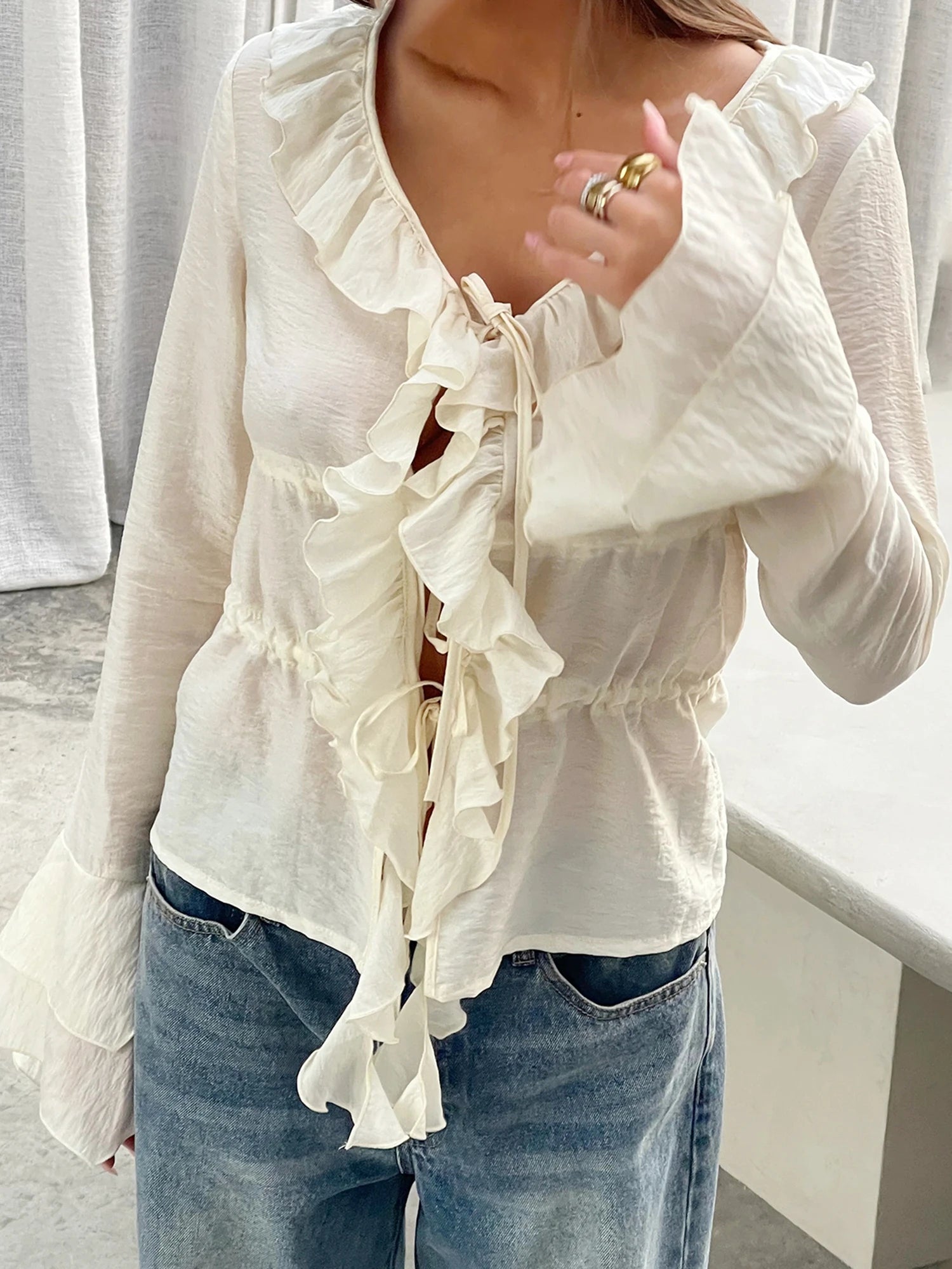 LIZAKOSHT  -  Elegant Women s V-Neck Peplum Blouse with Flowy Front Bow Tie Long Sleeve and Ruffle Trim Detail for a Stylish Look