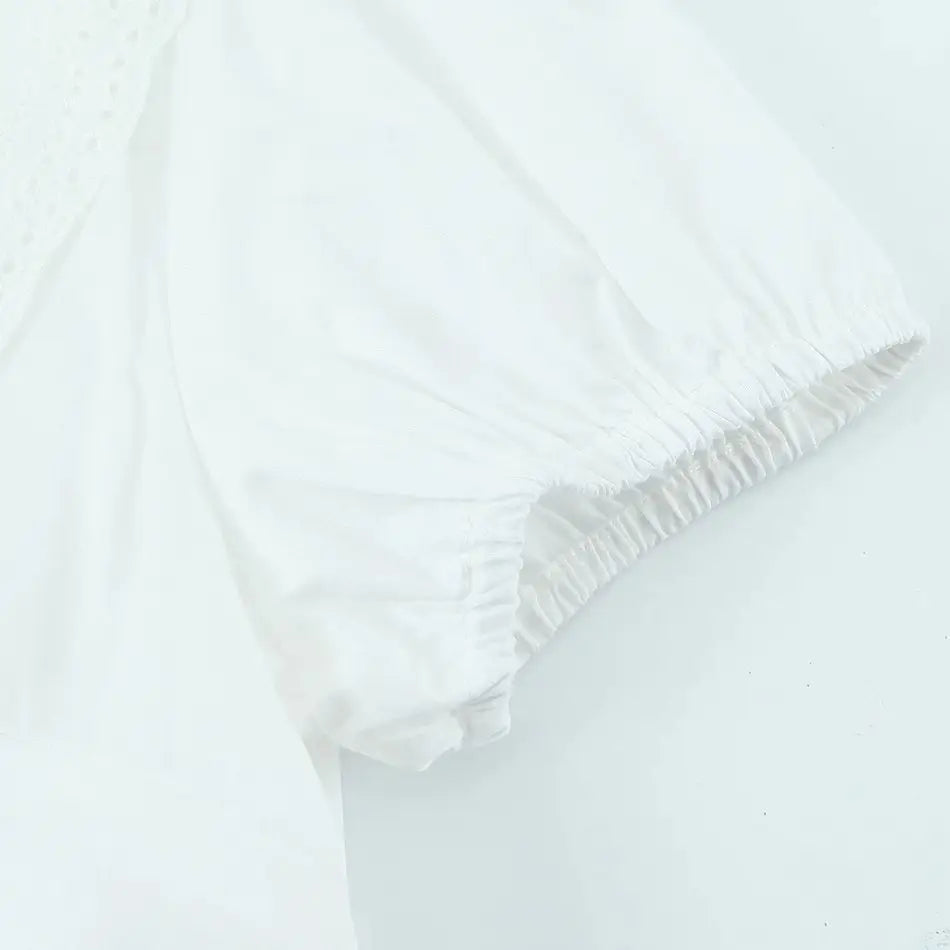 LIZAKOSHT  -  Sexy White Embroidery Hollow Out Hole Wood ears O neck Short Puff Sleeve Shirt Women Ruffles Hem Front Bow Lacing Up Crop Tops