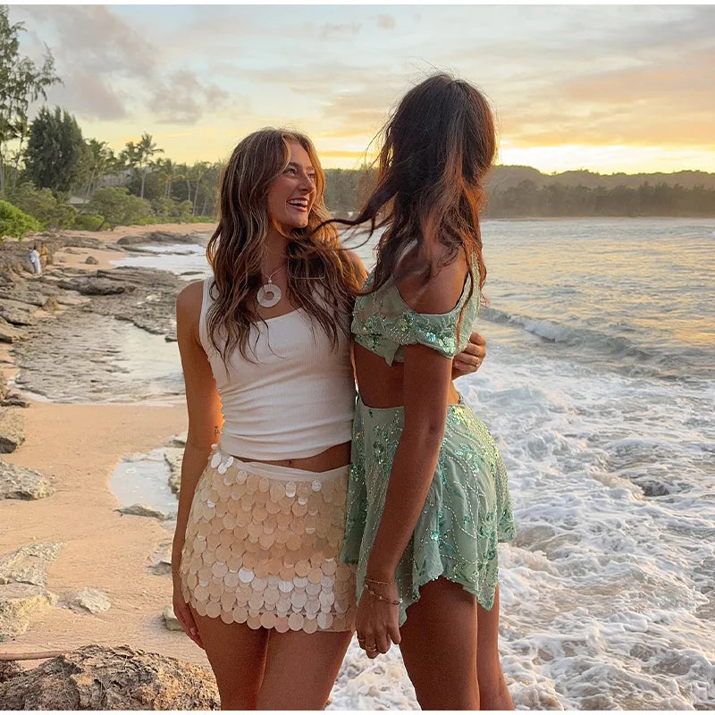 LIZAKOSHT  -  Sexy Beach Mini Skirts Women Slim Fashion Chic Shiny Short Skirt Female 2025 Spring Summer High Waist Solid Vacation Streetwear