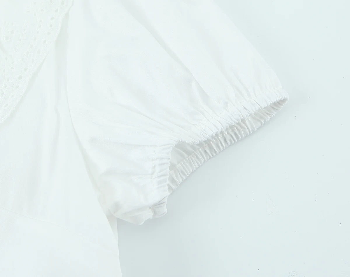 LIZAKOSHT  -  Sexy White Embroidery Hollow Out Hole Wood ears O neck Short Puff Sleeve Shirt Women Ruffles Hem Front Bow Lacing Up Crop Tops