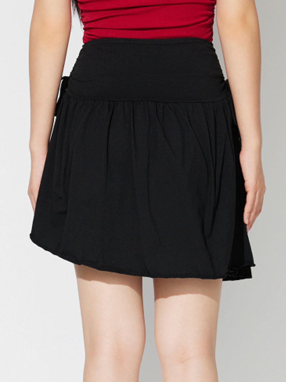 LIZAKOSHT  -  Side Tie Asymmetric Hem Mini Skirt