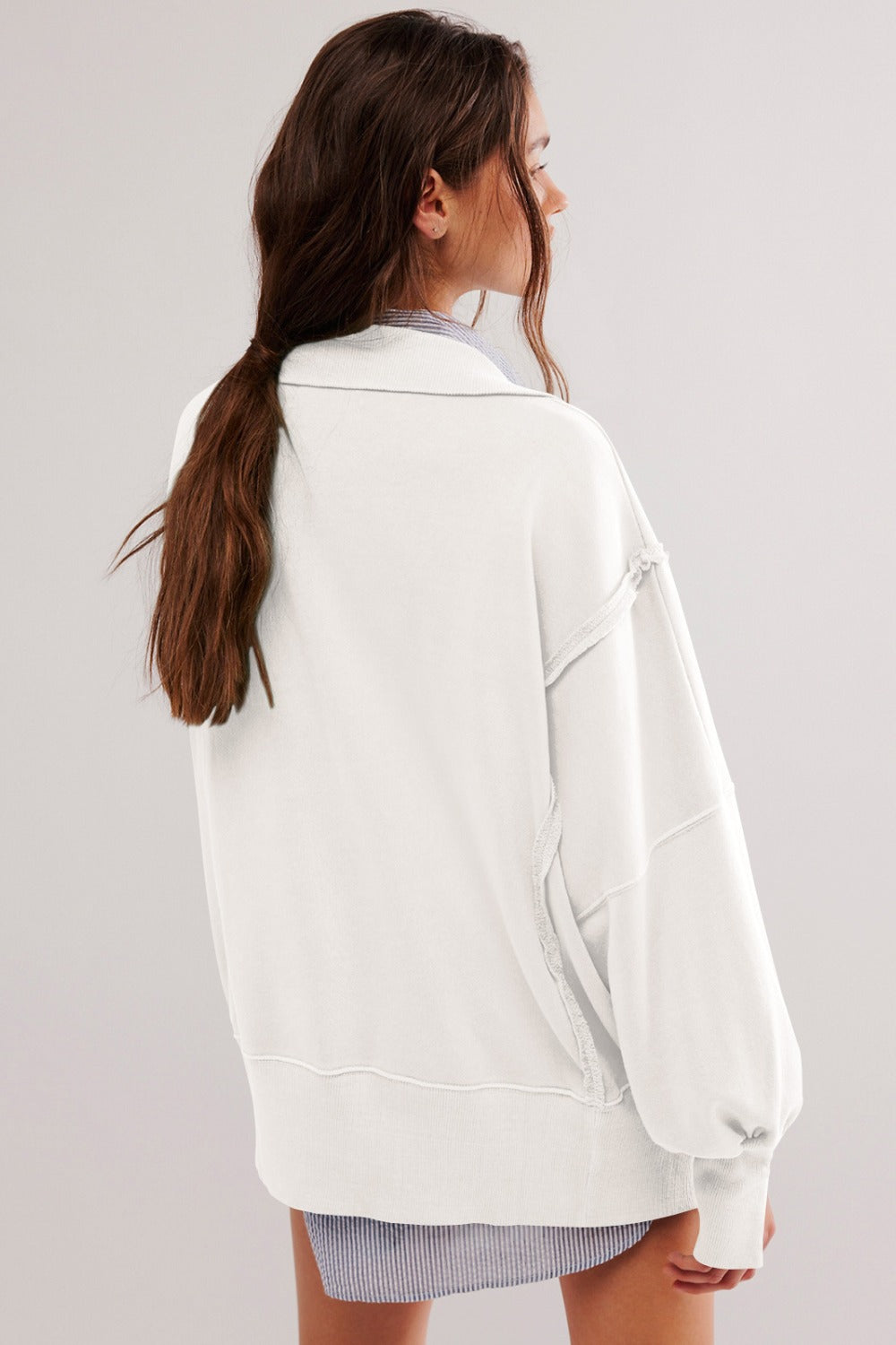 LIZAKOSHT  -  Exposed Seam Side Slit Long Sleeve Sweatshirt