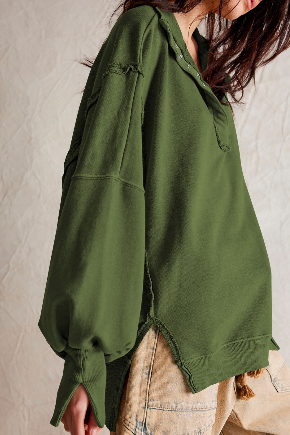LIZAKOSHT  -  Exposed Seam Side Slit Long Sleeve Sweatshirt