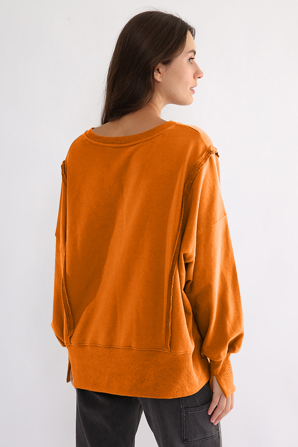 LIZAKOSHT  -  Exposed Seam High-Low Long Sleeve Sweatshirt
