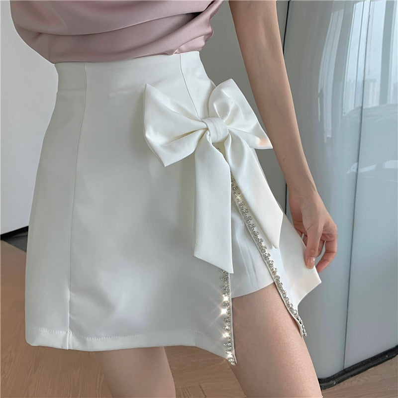 PERHAPS U Women High Street Sweet Solid Color Girls Bow Diamonds Asymmetrical Irregular High Waist A-Line Short Skirt S3010